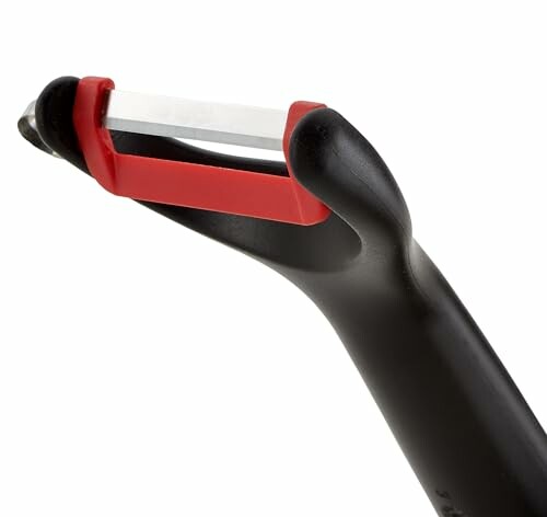 Éplucheur en céramique avec poignée noire.